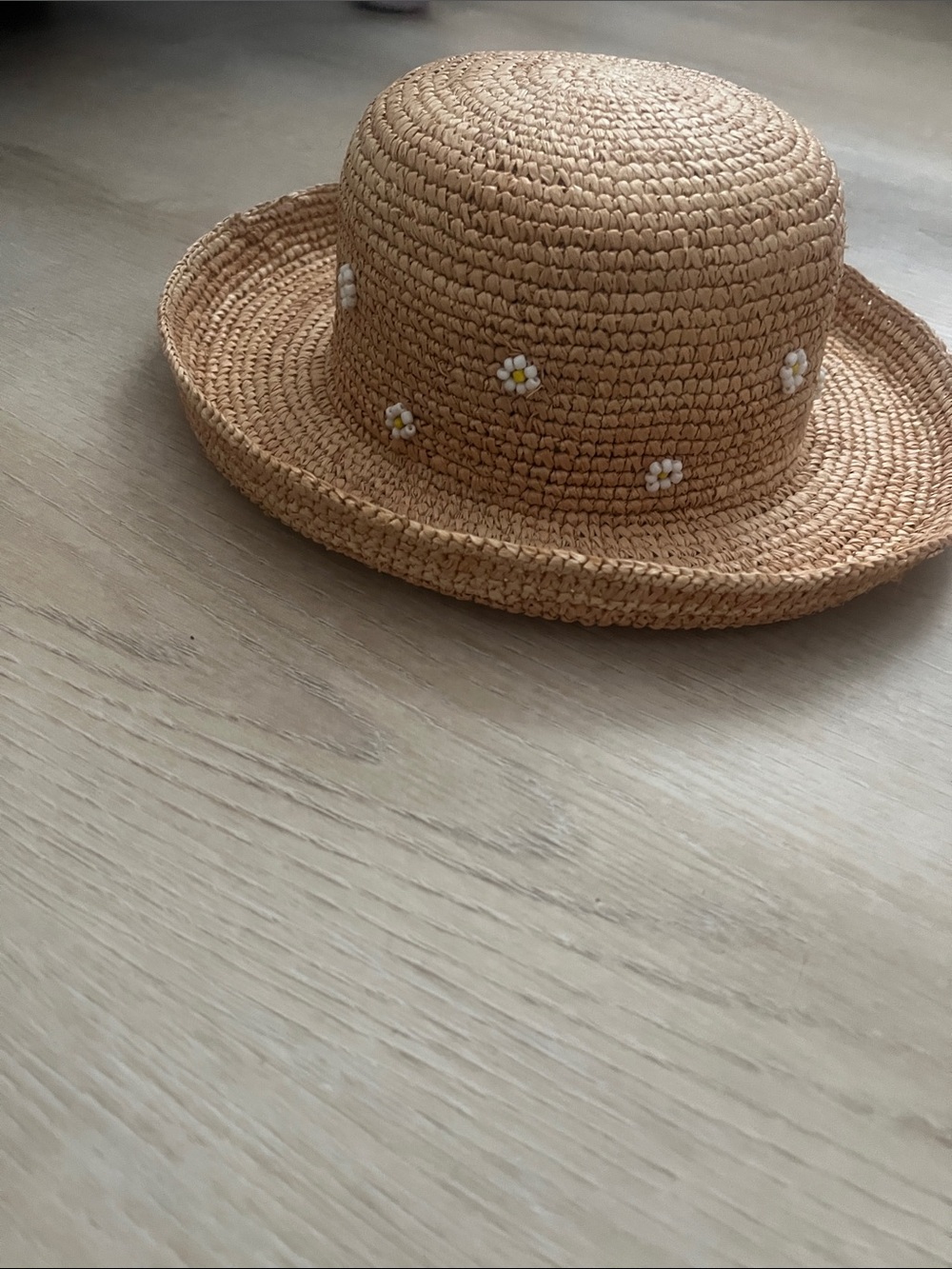 Lack Of Color ladies Tan Raffia Straw Bucket Hat with Daisy Embroidery.